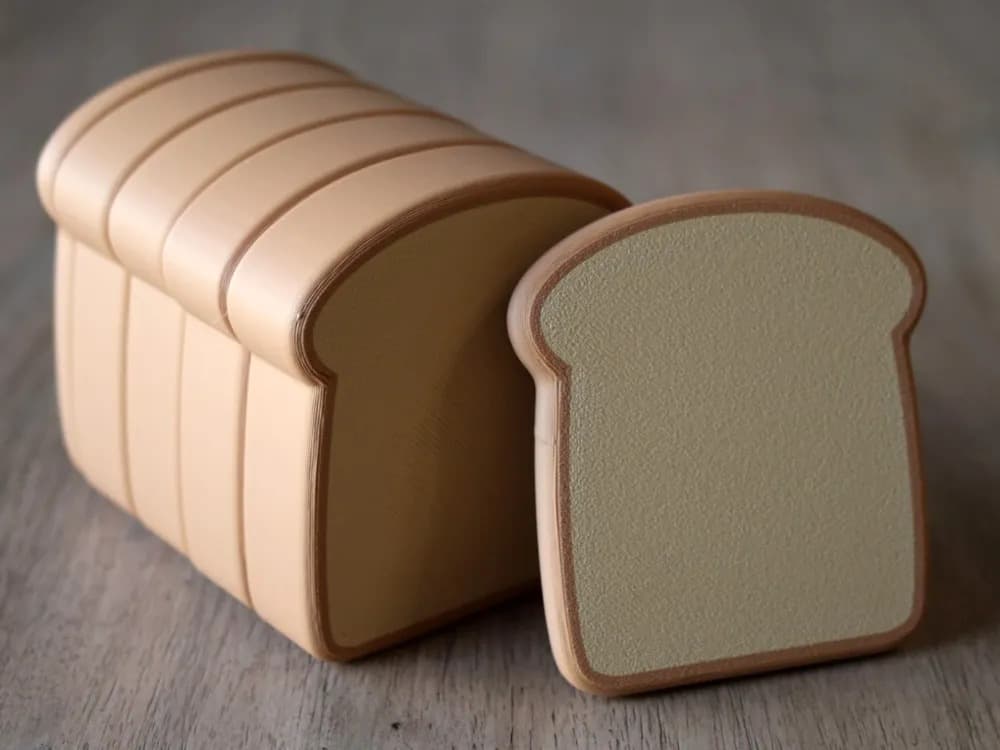 Magnetic pretend bread loaf that slices apart and snaps back together